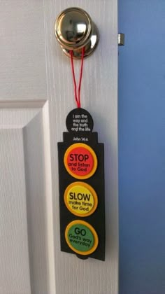 a door hanger that says stop and slow with two buttons attached to the handle