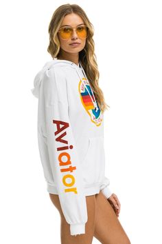 This Aviator Nation Hoodie is a staple to every wardrobe. We recommend owning it in as many colors as possible. The most comfortable hoodie you'll ever own. Our single needle stitch work gives each garment a unique, one of a kind effect. All of our products go through an intense breaking-down process that gives them a vintage feel you'll love because it's broken in from day one of wearing it. You're going to live in this hoodie. - Hoodies are UNISEX sizing- Hand sewn in our own factory in the heart of Los Angeles- Tri-Blend Fabric: 50% polyester, 38% cotton, 12% rayon- Machine wash cold with like colors. Hang or tumble dry on low Please note this hoodie will ship with the Manhattan Beach logo Willow Gifts, Avatar Nation, Aviator Nation Hoodie, Teen Sweater, Beach Logo, Boyfriend Hoodie, The Aviator, Stitch Work, Aviator Nation