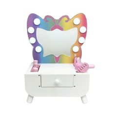 a white vanity with an illuminated mirror and lights on it's sides, in front of a white background