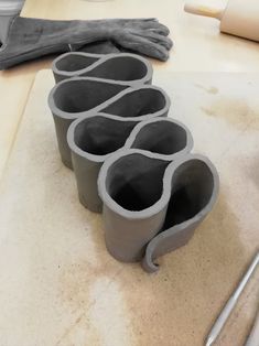 a close up of some clay cups on a table