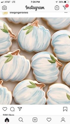 cookies decorated with blue and white pumpkins are displayed on the instagramr page