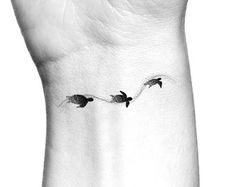 three birds flying through the air on a white background tattoo designs for men and women