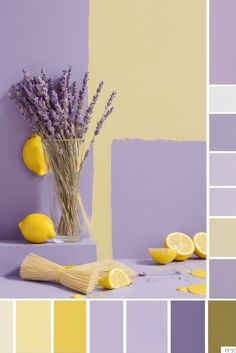 a vase filled with lemons and lavender on top of a table next to paint swatches