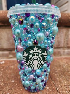 a starbucks cup made out of beads and pearls