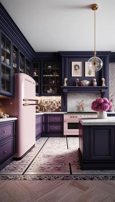 a kitchen with purple cabinets and marble counter tops, an island in the middle has pink flowers on it