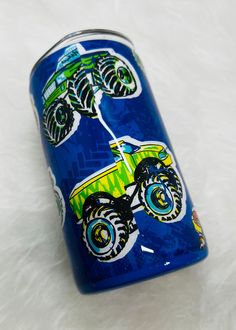 a blue can with monster trucks painted on it