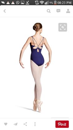 a woman in a leotard and ballet shoes