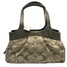 Coach Signature Lexi Shoulder Bag Features: • Khaki/Copper. Double copper brown leather handles. Roomy zipper center compartment. 2 snap closure sections. 4 inside open pockets & 1 zip inside pocket. Satin fabric lining. Size: Womens Large Measurements: Height 9 in / 23 cm Width 15.5 in / 39 cm Depth 4.5 in / 11 cm Handle Drop 9 in / 23 cm Condition: New With Tags Smoke free home. Offers Welcome! P8 Coach Satchel With Zipper Pocket For Travel, Coach Satchel For Travel, Coach Shoulder Bag With Double Handle And Zipper Pocket, Coach Leather Trim Satchel For Travel, Coach Satchel With Leather Trim For Travel, Coach Travel Satchel With Leather Trim, Coach Satchel With Leather Trim For Everyday Use, Elegant Coach Shoulder Bag With Zipper Pocket, Brown Coach Shoulder Bag With Leather Trim