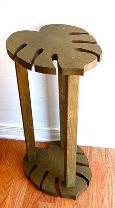 two wooden stools sitting on top of a hard wood floor