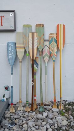 there are many paddles lined up against the wall