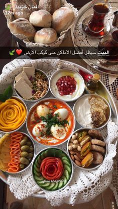 an assortment of food in bowls on a table