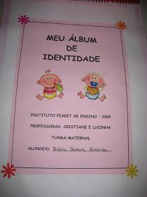 a pink book with two baby babies on it's cover and the words meu album de indentidade written in spanish