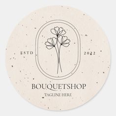 a round sticker with the words boutique shop and flowers in black ink on it