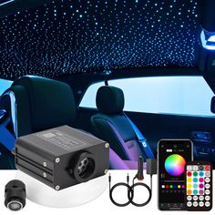 the interior of a car with blue lights and remote controls in front of it, along with other accessories