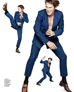 a man in a blue suit is dancing with his legs spread out and one leg up