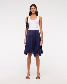 High rise midi skirt in our soft satin fabric, featuring asymmetrical ruffle hem and an elasticated pull-on style waistband for maximum comfort. Stretch Blue Midi Skirt, High-waist Blue Relaxed Skirt, Navy Midi Lined Skirt, Blue Asymmetrical Relaxed Fit Skirt, Non-stretch Mid-rise Blue Skirt, Satin Midi Skirt, Women Skirts Midi, Ruffle Hem, Satin Fabric