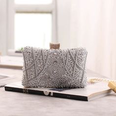 Captivating, Elegant, and Wedding-Ready – The Luxe Silver Wedding Clutch Bag is a showstopping accessory designed to elevate your bridal gown or wedding guest dress with whimsical beaded elegance. Featuring intricate silver beading and shimmering sequins, this silver wedding clutch bag exudes timeless sophistication and glamour for your most special occasions. Why We Love It...We adore the dazzling silver bead and sequin design that beautifully catches the light, adding a touch of opulence to an Prom Handbag, Pearl Clutch Bag, Silver Clutch Bag, Beaded Clutch Bag, Pearl Clutch, Bridesmaid Clutches, Clutch Bag Wedding, Party Handbags, Silver Clutch