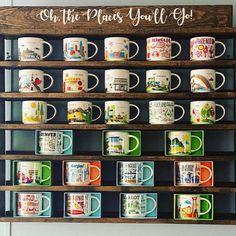 coffee mugs are lined up on a shelf with the words, on the places you'll go