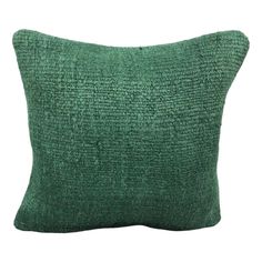 a green pillow with a textured design on the front and back, it is made from