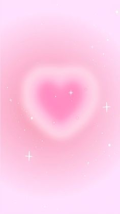 a pink heart shaped object with stars in the background