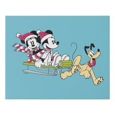 an image of mickey and minnie on sled