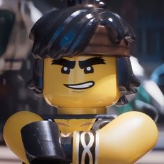 the lego movie character is wearing a helmet