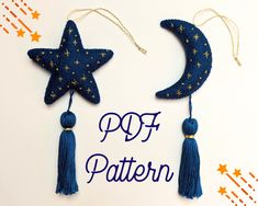 two stars and a crescent hanging from strings with the words 997 pattern written below