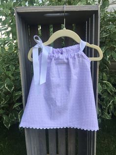 Perfect for those warm summer days.  This sundress is made of pre-washed, high quality, light weight 100% cotton.  The armholes have been finished with matching seam binding.  All other seams are finished.  Remove ribbon prior to washing.  Machine wash and dry.  Iron as needed. Spring Gingham Cotton Sundress, Summer Cotton Sundress For Picnic, Summer Style Cotton Sundress For Picnic, Plaid Cotton Sundress For The Beach, Plaid Cotton Sundress For Picnic, Plaid Cotton Sundress For Picnics, White Cotton Sundress For Picnic, Cute Cotton Sundress For Daywear, Purple Sleeveless Cotton Sundress