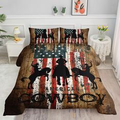 this is a bed with an american flag and cowboy silhouettes on the front cover