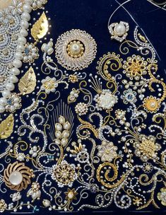 an elaborately designed piece of cloth with beads and pearls