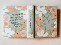 an open book with flowers and bible verse