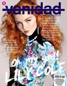 a woman with long red hair on the cover of a magazine