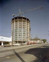 a tall building sitting on the side of a road