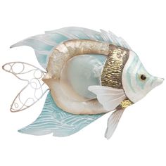 a glass fish figurine sitting on top of a white surface