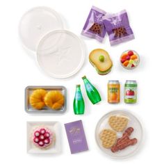 an assortment of food items displayed on a white surface