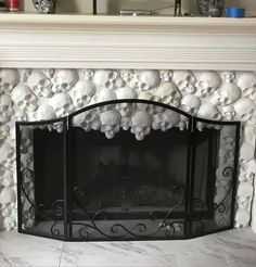 the fireplace is decorated with skulls and bones