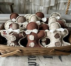 a basket filled with teddy bears sitting on top of a table