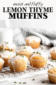 lemon thyme muffins on a cooling rack next to a glass of milk