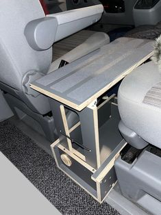 the interior of a vehicle with an animal in it's cage on the floor