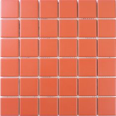 a close up view of an orange tile wall