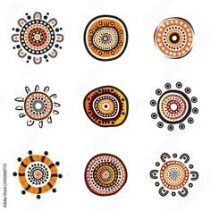 an assortment of different designs on white paper with black and orange circles in the middle