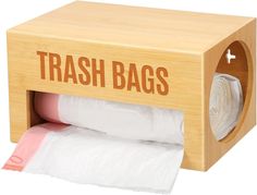 a wooden trash bag dispenser with two rolls of toilet paper in it