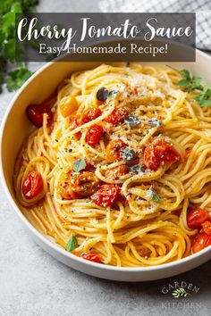 a white bowl filled with pasta covered in tomato sauce