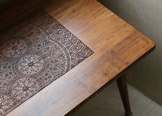 a wooden table with an intricate design on it