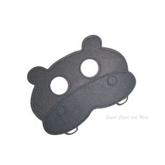 a gray mask with two holes on the front and one hole in the middle,