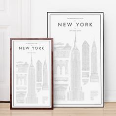 the new york city skyline is displayed in front of a chair and bookshelf