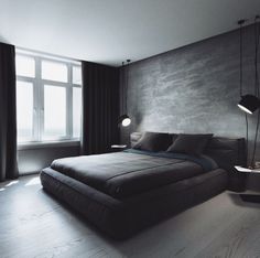 a large bed sitting next to a window in a room with wooden floors and walls