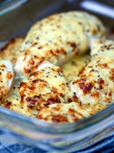 a glass dish filled with chicken and cheese