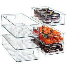 two clear containers with tomatoes and olives in them