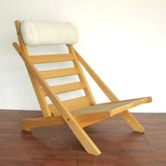 a wooden chair sitting on top of a hard wood floor